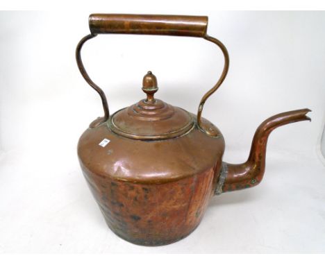 A Victorian copper kettle.
