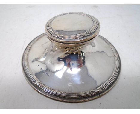 A Birmingham silver inkwell with Bakelite liner.