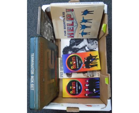 A box containing The Beatles and Bruce Springsteen CD box sets together with a Terminator 2 Box set.