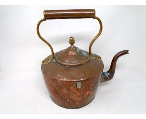 A Victorian copper kettle.