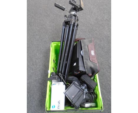 A crate containing Manfrotto professional tripod, a Baurn projector together with assorted cameras.