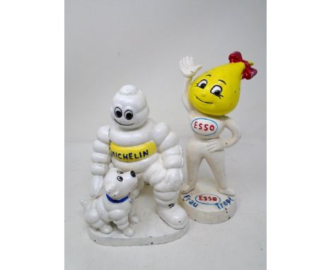 Two cast iron figures Esso Abby Slick and Michelin man with dog.