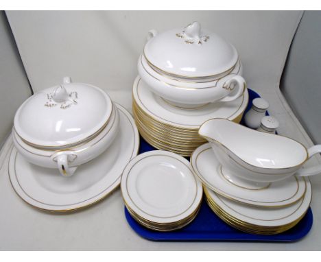 A set of 32 pieces of Royal Worcester Contessa white and gilt dinner ware.