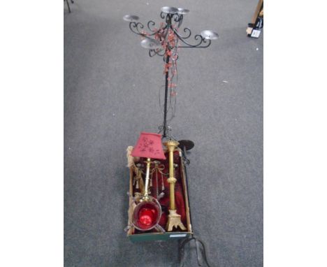 A box containing a fringed Persian rug, brass table lamp with shade, brass ecclesiastical candlestick together with two furth