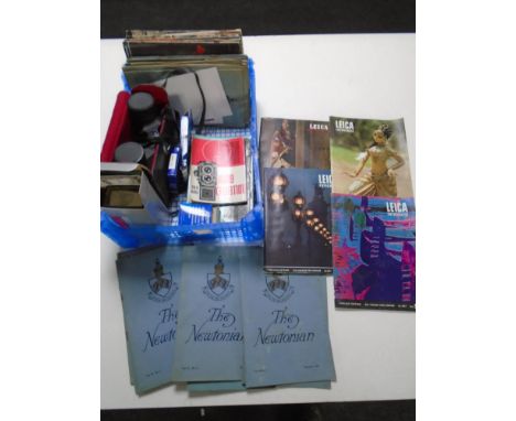 A box containing Falcon Zoom 18x6 field glasses, camera guides, Leica books, filters etc.