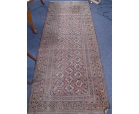 A Bokhara runner, Afghanistan, 288cm by 123cm