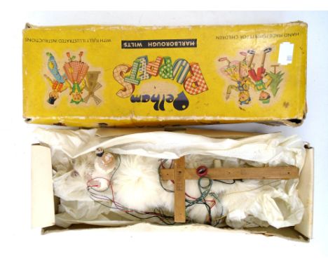 A boxed Pelham puppet of a poodle.