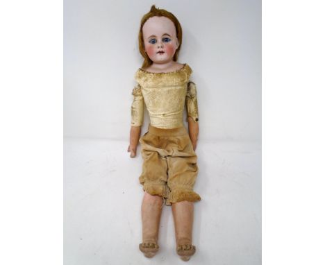 A Victorian bisque-headed jointed doll.
