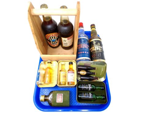 A tray containing assorted alcohol including Glenmorangie and Ardbeg scotch whiskies in tins, miniature Guinness bottles, New