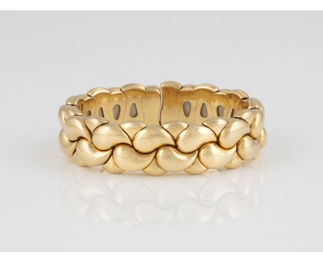 ARMREIF 'CHOPARD - CASMIR' Gelbgold. Innenmaß ca. 5,5 x 4,3 cm, Ges.-Gew. ca. 102,7 g. Gest. 750, Herstellersignet, Modellnam