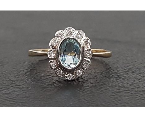 AQUAMARINE AND DIAMOND CLUSTER RINGthe oval cut aquamarine in twelve diamond surround, on nine carat gold shank, ring size N-