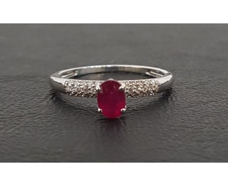 RUBY AND DIAMOND RINGthe central oval cut ruby approximately 0.4cts flanked by pave set diamonds totaling approximately 0.2ct