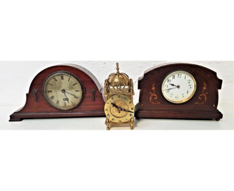 MAHOGANY CASED MANTLE CLOCKin an arched case with a silvered dial with Roman numerals and a 30 hour movement; an Art Nouveau 