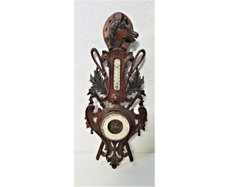 CARVED AND STAINED PINE ANEROID BAROMETERsurmounted with a horse head and horseshoe with a thermometer below, flanked by a pa
