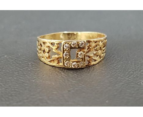 CZ SET UNMARKED GOLD RINGthe central stones if the form of the letter G, flanked by pierced shoulders, ring size R and approx