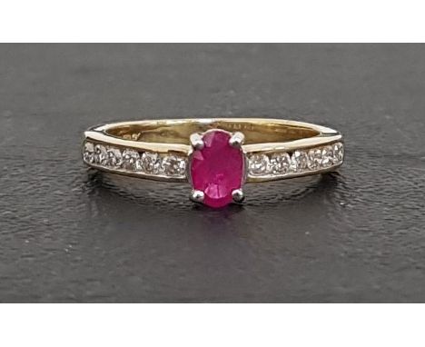 RUBY AND DIAMOND RINGthe central oval cut ruby approximately 0.3cts flanked by channel set diamonds totaling approximately 0.