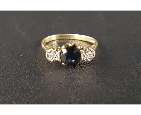 SAPPHIRE AND DIAMOND THREE STONE RINGthe central oval cut sapphire approximately 0.9cts flanked by illusion set diamonds, on 