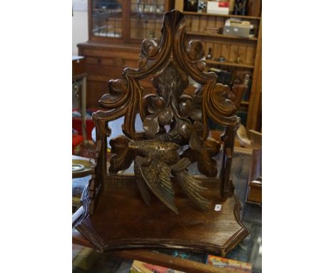 Black Forest carved wood fret work wall bracket depicting a bird on a tree