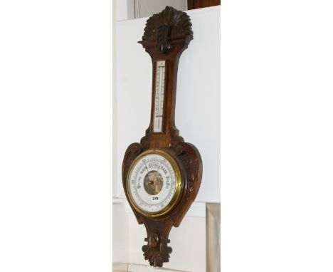 Victorian barometer and thermometer wall mounted in carved oak case