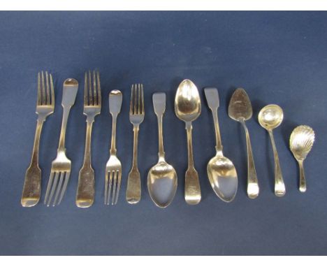 Three antique Irish silver fiddle pattern table forks, with sauce ladle, small cake slice and shell bowled caddy spoon, 17oz 