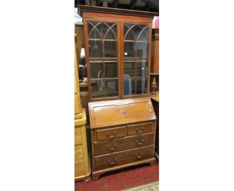 A good quality Edwardian mahogany bureau bookcase in the Georgian style, the upper section enclosed by a pair of astragal gla