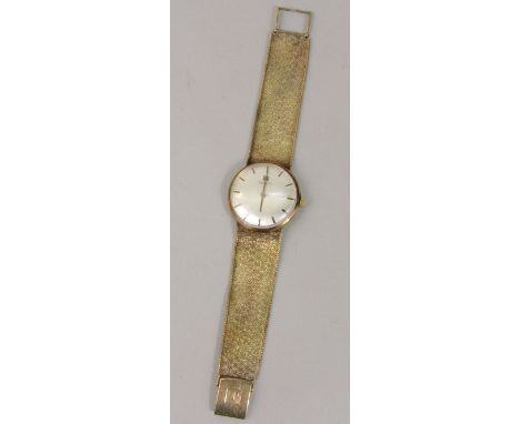 Vintage 9ct Tissot gent's dress watch, the champagne dial with black baton markers upon a good original mesh strap, manual wi