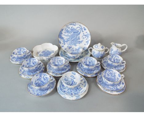 A collection of Royal Worcester blue dragon pattern teawares comprising seven cups, seven saucers and six tea plates, milk ju