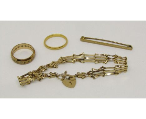 22ct wedding ring, 2.8g (misshapen), together with a group of 9ct jewellery comprising a gate link bracelet with heart padloc