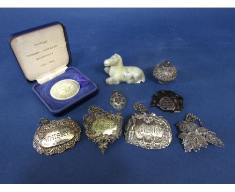 Four various silver decanter labels to include a good Sherry decanter label decorated in relief with a hunting scene and fox 