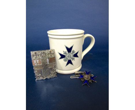 Nightingale School of Nursing at St Thomas Hospital silver and blue enamel badge, together with a further silver buckle and b