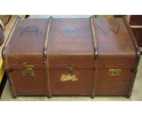 A vintage green canvas travelling trunk with timber lathes, one other, a vintage wicker work laundry basket, and a further vi