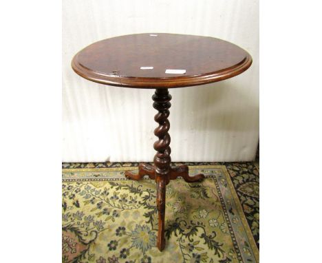 Two Victorian walnut and figured walnut occasional tables, one with a shaped and one with a circular top, on decorated column