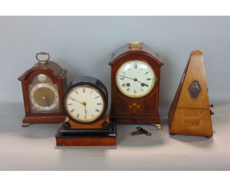 Art nouveau walnut two train drum head mantel clock, with box wood inlay, the enamelled dial with Roman numerals, 23cm high; 