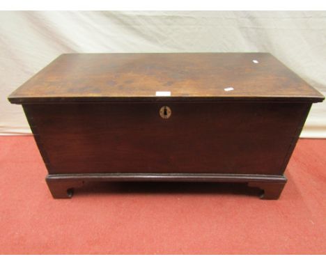 A Georgian oak chest of simple form, raised on bracket supports, 83cm long