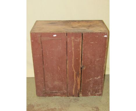 A small rustic painted pine and elm side cupboard enclosed by a tongue and groove panelled door