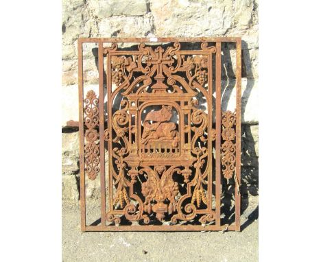 A small 19th century cast iron ecclesiastical door, the rectangular frame enclosing a decorative panel with central recumbent