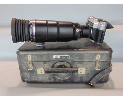 A cased Zenit photosniper ES reflex camera with a Tair-3 Phs long focus lens and accessories