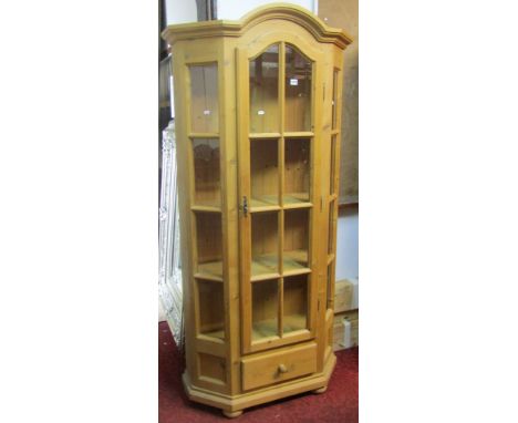 A contemporary Dutch style stripped pine breakfront side cabinet, freestanding and enclosed by a three quarter length arched 