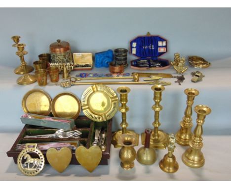 A box containing a mixed collection of metal wares to include various brass candlesticks and brassware, silver plated items t