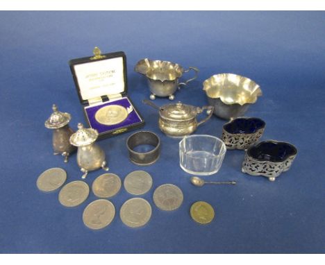 A mixed collection of silver to include wavy rimmed silver milk jug and sucrier, pair of lobed silver salts with blue glass l