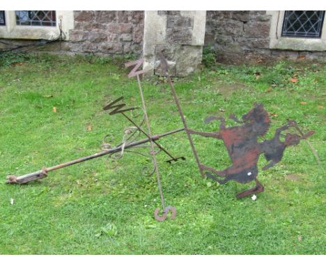 An ironwork weather vane, the raised cut sheet steel finial in the form of a mounted cavalry man wielding his sabre aloft