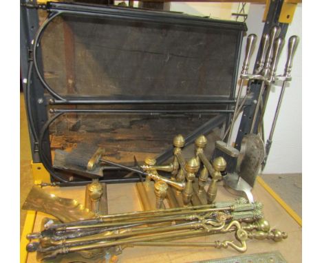 A small collection of 19th century and later brass and steel fire irons, two pairs of brass fire dogs of varying design, cont