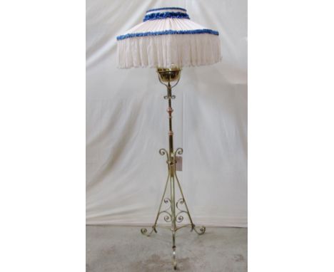 A polished brass telescopic oil lamp standard with copper flower head detail, scrolled tripod supports, beneath a removeable 