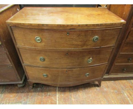 A small mid 19th century mahogany bow fronted chest of three long drawers on swept supports, 90cm wide
