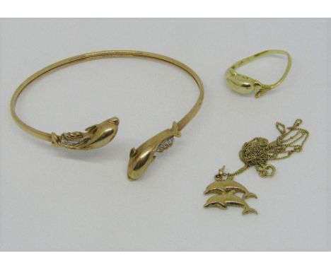 Group of 9ct novelty dolphin jewellery comprising diamond set bangle, a pendant necklace and ring, 11.4g total (ring misshape