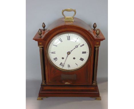 Edwardian walnut boardroom clock, the 8 inch enamel dial fitted with Roman numerals, flaked by brass corinthian columns and a