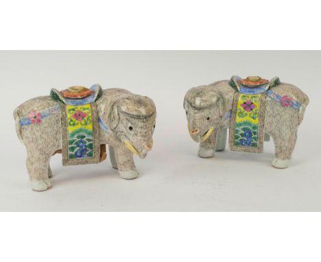 CHINESE EXPORT ELEPHANT CANDLESTICKS, a pair, famille rose canton enamel decoration, 18cm. (2) 