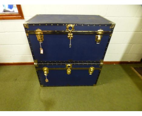 Two large Mossman leather trunks, 91cm wide x 49cm high x 52cm depth, keys to one trunk and no keys and central lock broken t