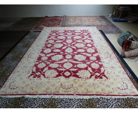 Modern handmade Ziegler carpet, plum central panel decorated with large stylised flowers with a wide oat meal border 412 x 31