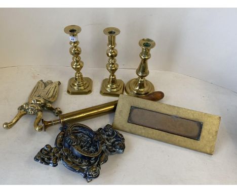 Qty of brass candle sticks and boot jack in the form of  beetle, brass letter box &amp; door knocker.  CONDITION: general wea